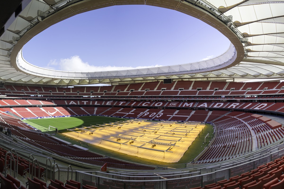 Empty Metropolitano stadium in Madrid, photographed February 10, 2018, with grass grow lights; historical venue context, not the 2027 final.