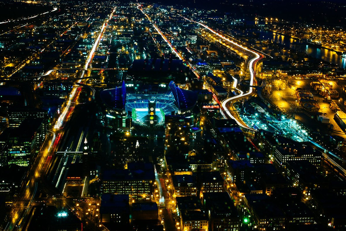 Aerial night view of Seattle's football stadium and surrounding SoDo streets, photographed in 2014; venue context only, not the September 2026 game.