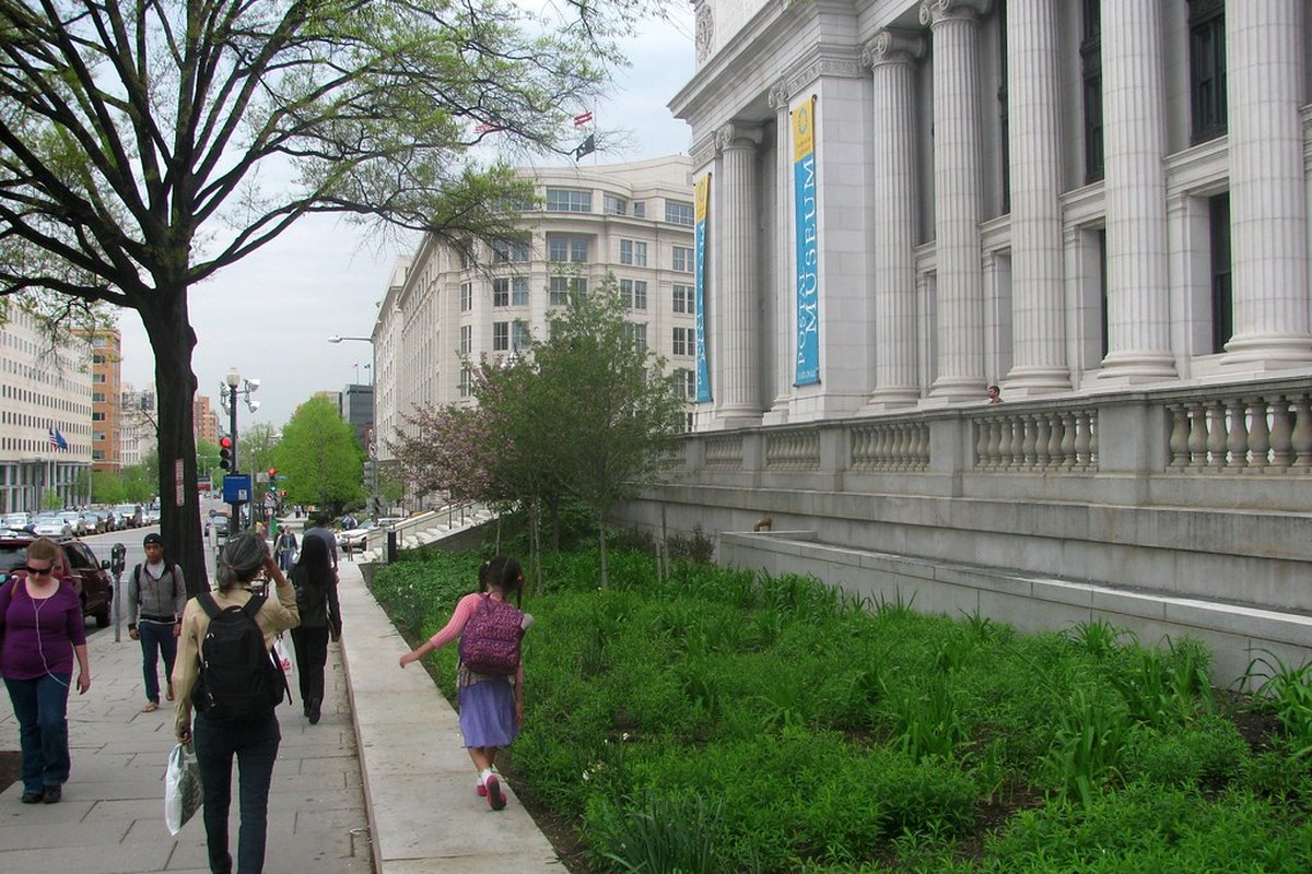 Pedestrians passing the historic federal office building that houses the U.S. Bureau of Labor Statistics