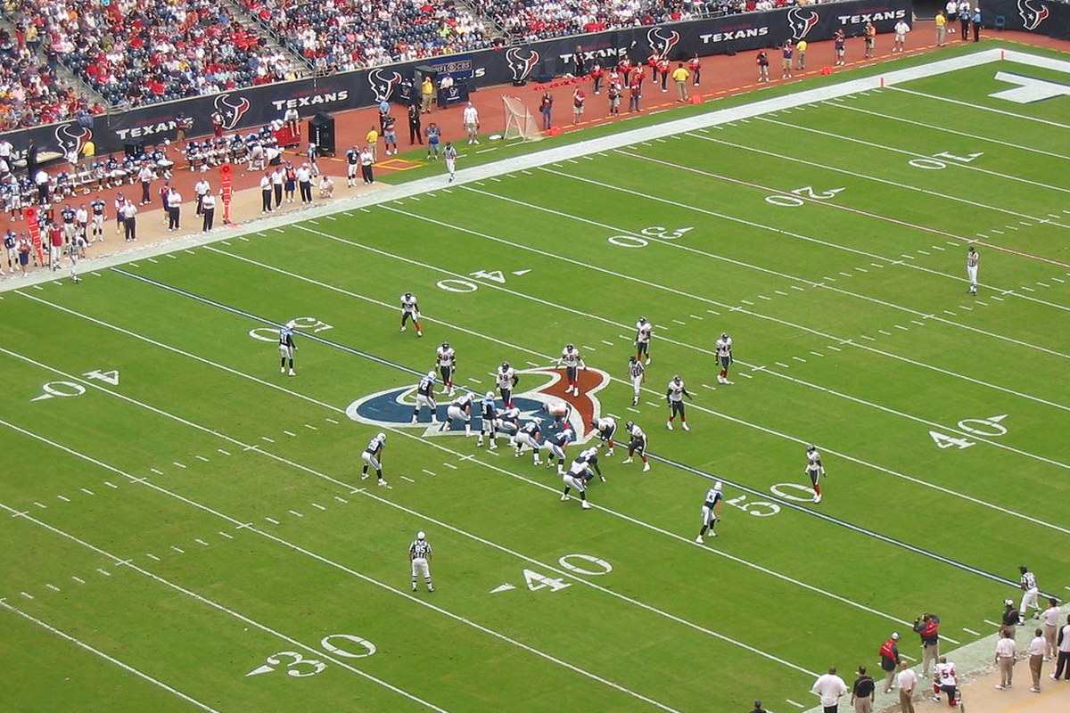 NFL football game in progress at a stadium
